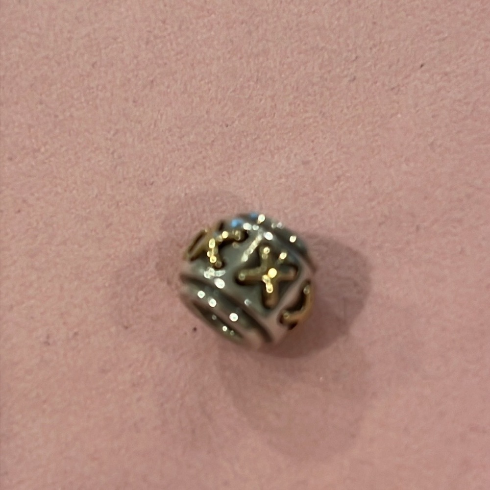 Pandora Sterling Silver Charm with 14kt gold X Pattern.#790290
